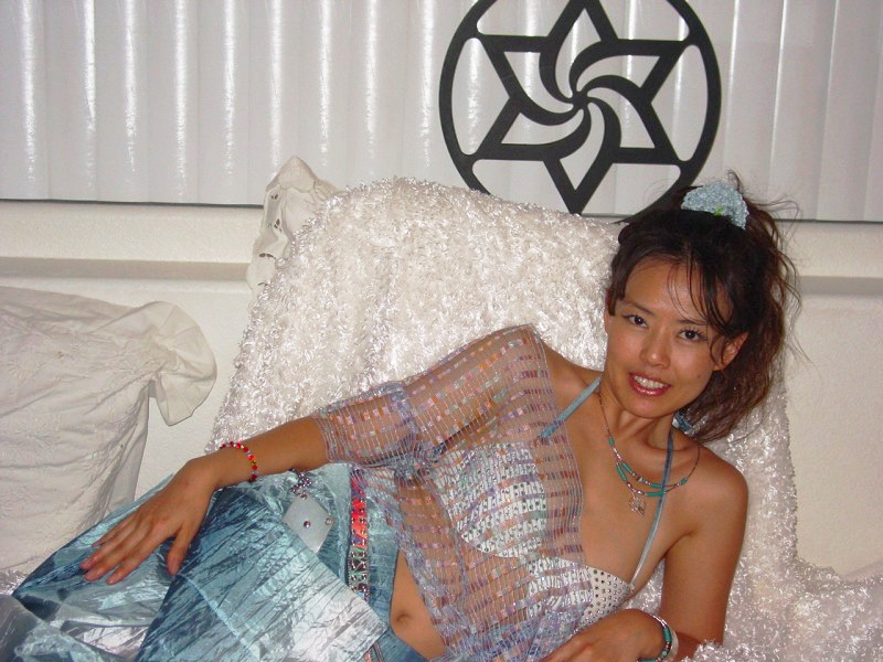 Lady_on_bed_adorned_with_Raelian_symbol-1